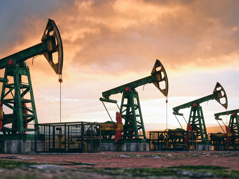 working oil pumps against a sunset sky Asbestos Canada Ontario