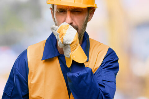 Construction worker coughing in Ontario Canada