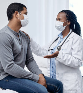 Medical worker talking to patient about asbestos exposure in Ontario Canada